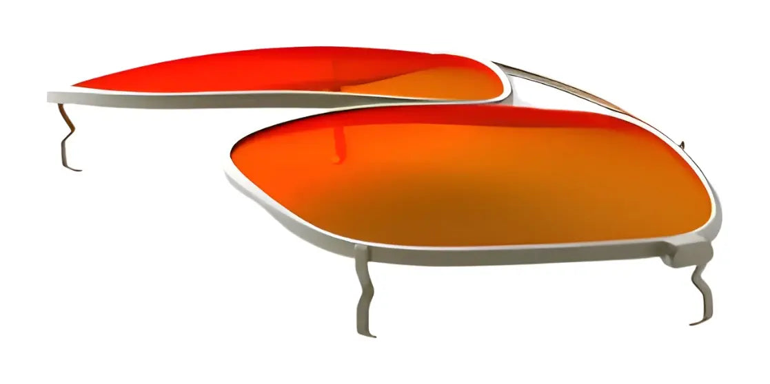 Close-up of orange-tinted RE Ranger Sporter Clip-On Lens with silver frames, detached and lying on a white background.