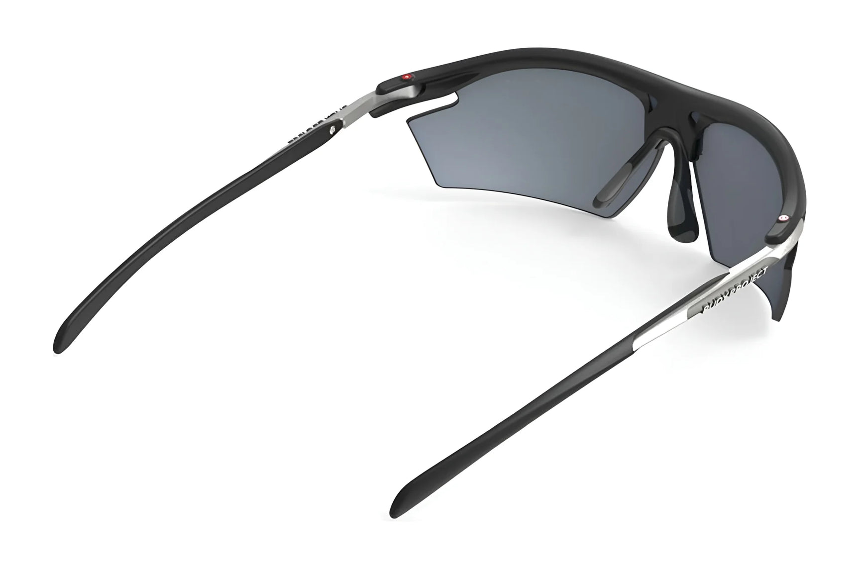 Rudy Project Rydon Sunglasses by Rudy Project, featuring curved arms, dark lenses, and adjustable anti-slip nosepads, shown from the back and side angles. Rudy Project Rydon Sunglasses by Rudy Project, featuring curved arms, dark lenses, and adjustable anti-slip nosepads, shown from the back and side angles.