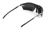 Rudy Project Rydon Sunglasses by Rudy Project, shown from the back on a white background, feature black frames with dark lenses, curved arms, and adjustable anti-slip nosepads.