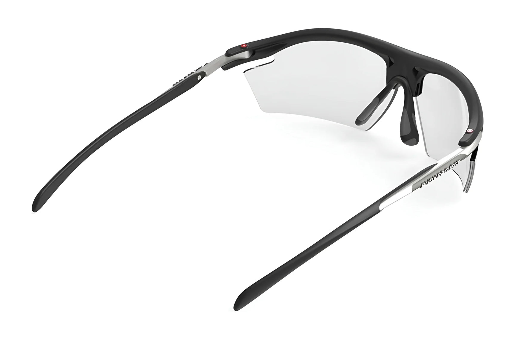 Angled view of Rudy Project Rydon Sunglasses in black with clear lenses, adjustable anti-slip nosepads, and "Rudy Project" branding on the right arm. Angled view of Rudy Project Rydon Sunglasses in black with clear lenses, adjustable anti-slip nosepads, and "Rudy Project" branding on the right arm.