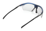 Rudy Project Rydon Sunglasses by Rudy Project in translucent blue with clear lenses, black arms, and adjustable anti-slip nosepads, shown from the back angle.