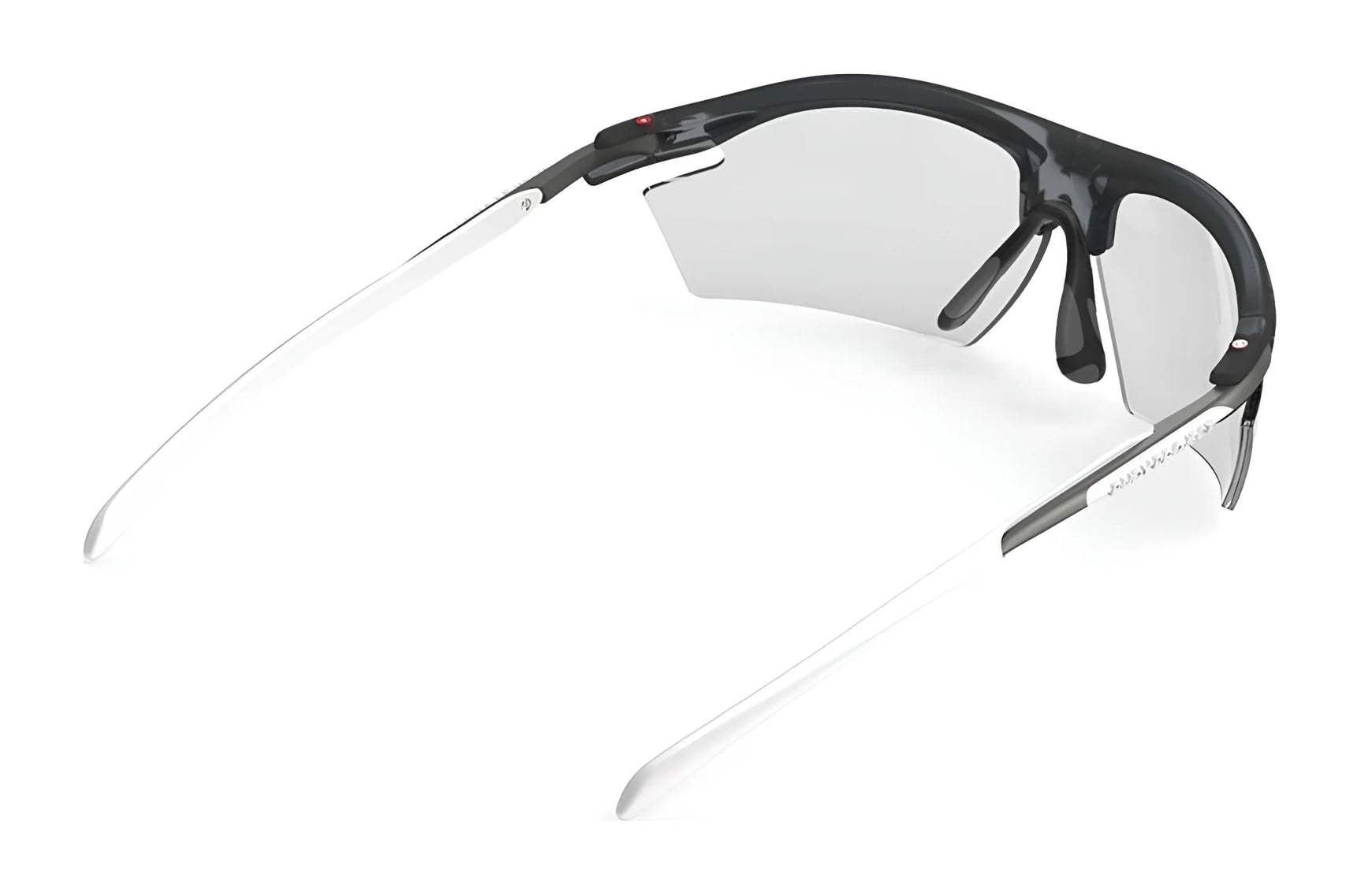 The Rudy Project Rydon Sunglasses by Rudy Project feature a sleek black and white design with semi-rimless clear lenses, seen from the rear, and adjustable anti-slip nosepads for a secure fit. The Rudy Project Rydon Sunglasses by Rudy Project feature a sleek black and white design with semi-rimless clear lenses, seen from the rear, and adjustable anti-slip nosepads for a secure fit.