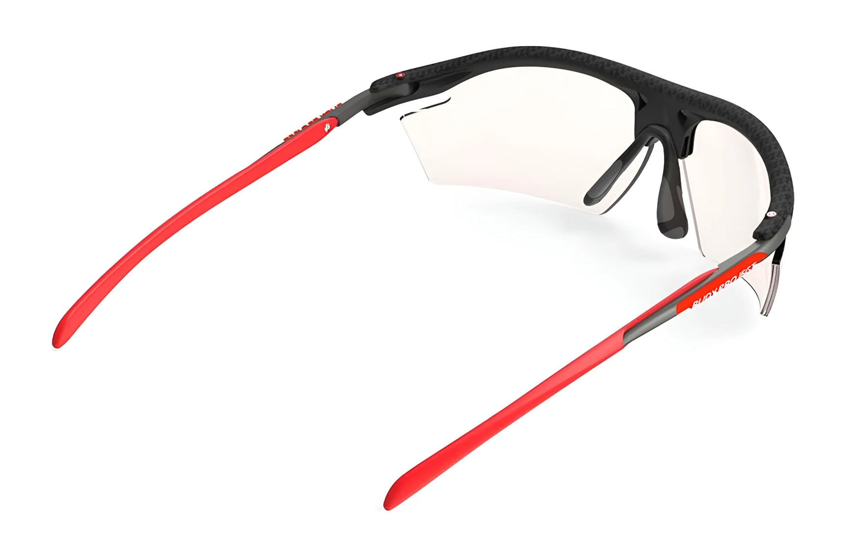The Rudy Project Rydon Sunglasses feature red arms, a black frame, and clear lenses with adjustable anti-slip nosepads for a secure fit. Shown on a white background. The Rudy Project Rydon Sunglasses feature red arms, a black frame, and clear lenses with adjustable anti-slip nosepads for a secure fit. Shown on a white background.