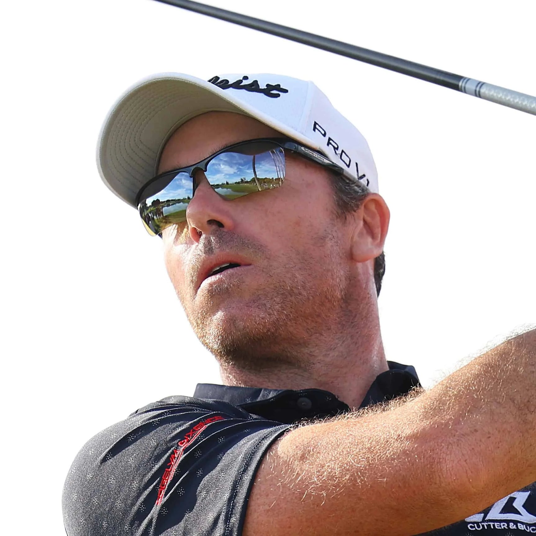 A person wearing Scheyden CIA GRABBER Sunglasses and a cap, swinging a golf club against a clear sky, perfectly embodies a relaxed day on the greens.
