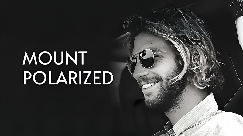 Man with long hair and beard wearing sunglasses, smiling, with "Mount Polarized" text beside him.